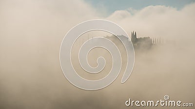Tuscany landscape with mist in the morning ,spring time ,agriculture crop and farming house Stock Photo