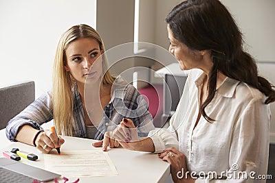 Tutor Using Learning Aids To Help Student With Dyslexia Stock Photo