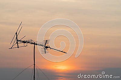 TV antenna against the background of the evening sky Stock Photo
