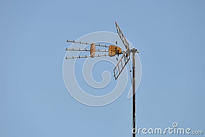 TV antenna against the blue sky Stock Photo