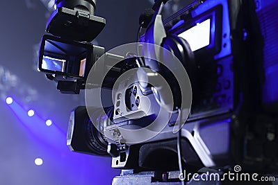 Tv camera in a concert hal. Professional digital video camera. Stock Photo