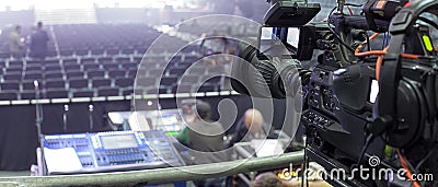 Tv camera in a concert hal. Professional digital video camera. Stock Photo