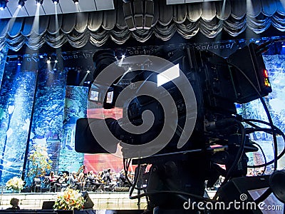 Tv camera in a concert hal. Professional digital video camera. Stock Photo