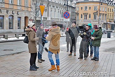 TV crew interviews an unknown celebrity in Warsaw, Poland. Editorial Stock Photo