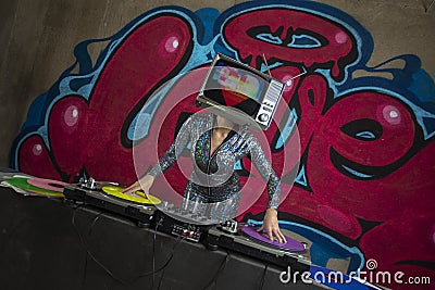 Tv head woman and graffiti wall dj Editorial Stock Photo