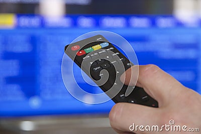 TV Remote Control and Hand Stock Photo