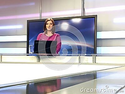 TV reporter at the news desk Stock Photo