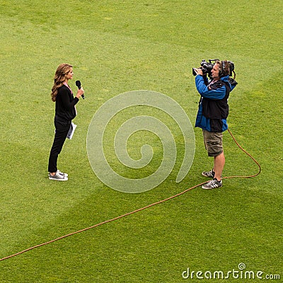 Woman TV Sports Reporter in Outside Broadcast Editorial Stock Photo