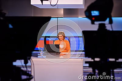 TV reporter at the news desk Stock Photo