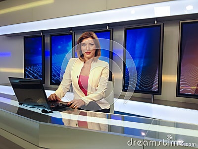 TV reporter at the news desk Stock Photo