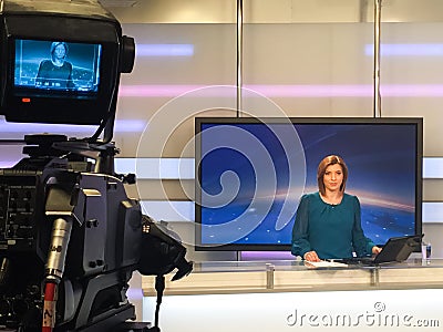 TV reporter at the news desk Stock Photo