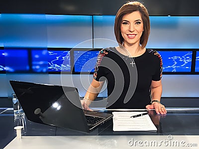 TV reporter at the news desk Stock Photo