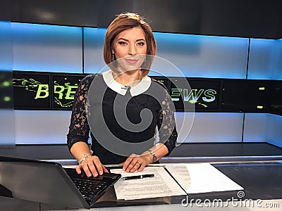 TV reporter at the news desk Stock Photo