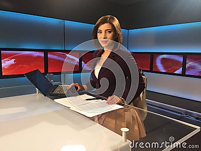 TV reporter at the news desk Stock Photo