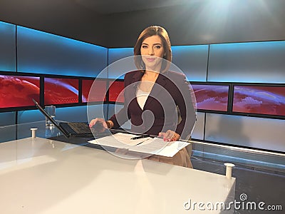 TV reporter at the news desk Stock Photo