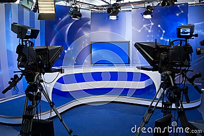 TV studio with camera and lights Stock Photo