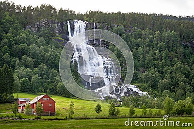 Tvindefossen waterfall in Norway village Stock Photo