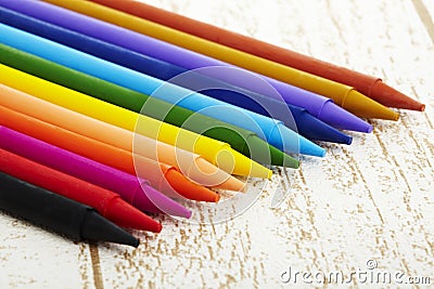 Twelve color pastel crayon in box close up with woody texture backgrou Stock Photo