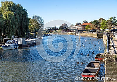 TWICKENHAM, RICHMOND, LONDON, UK - SEPTEMBER 20, 2019: View along the Thames river to the bridge which leads to Eel PIe Editorial Stock Photo