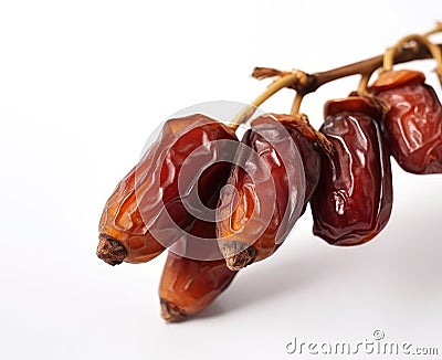 Twig of fruit of a dates - white background Stock Photo