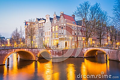 Twilight in Amsterdam city with dutch old buildings, Netherlands Stock Photo