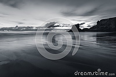 Twilight Reflections in monochrome, Porthcothan Beach, Cornwall Stock Photo