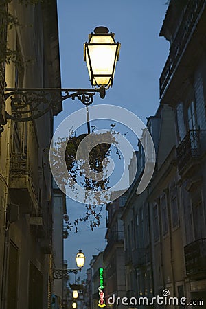 Twilight scene of lamp light and buildings in historic and popular tourist area, Barrio Alta, Lisbon/Lisboa Portugal Editorial Stock Photo