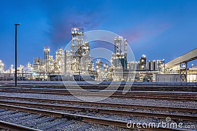 Twilight scene with a petrochemical production plant at Port of Antwerp, Belgium Stock Photo