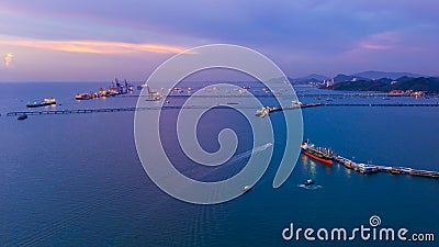 Twilight seascape and shipping port loading oil and gas on the sea Stock Photo