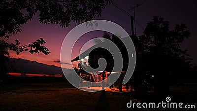 Twilight sky with silhouette house at the rural Stock Photo