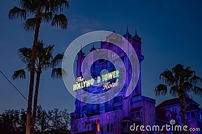 The Twilight zone Tower of Terror and palm trees on blue sky background in Hollywood Studios at Walt Disney World 3 Editorial Stock Photo