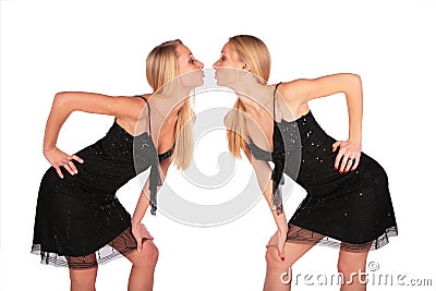 Twin girls face-to-face incline to each other Stock Photo