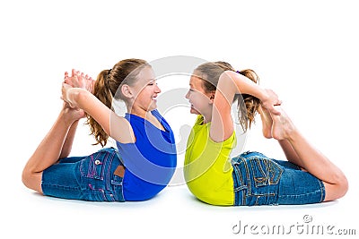 Twin kid sisters symmetrical flexible playing happy Stock Photo