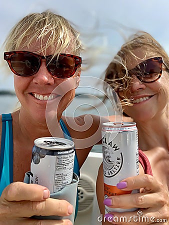 Twin Lakes, WI/USA - 09-11-2019: Happy women taking selfie with drinks on a boat Editorial Stock Photo