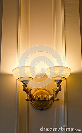 Twin Lamp on a wall shining. Stock Photo