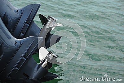 Twin outboard props on a boat in the water Stock Photo