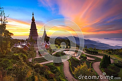 Twin pagoda in doi Inthanon national park with sunrise and morning mist at Chiang mai Stock Photo