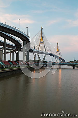 Twin suspension bridged crossing Bangkok river Stock Photo