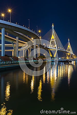 Twin suspension bridged crossing Bangkok river at twilight, Thailand Stock Photo