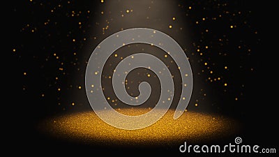 Twinkling golden glitter falling through a cone of light on a stage Stock Photo