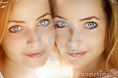 Twins. A group of young beautiful girls. Two women face close-up. Trendy stylish sisters Stock Photo