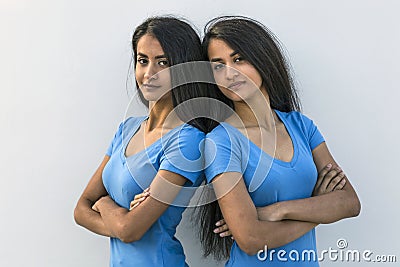 Twins pair backs to backs Stock Photo