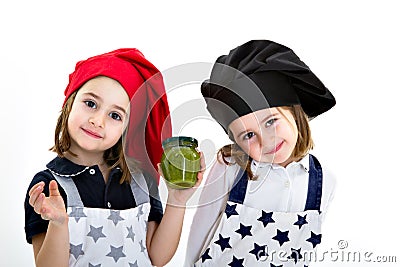 Twins sisters cook chef with pesto genovese Stock Photo