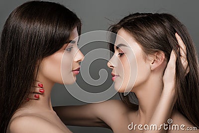 Twins women with perfect skin and natural make-up Stock Photo