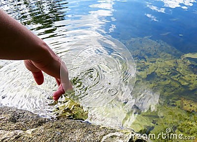 Twirling Finger in River Stock Photo