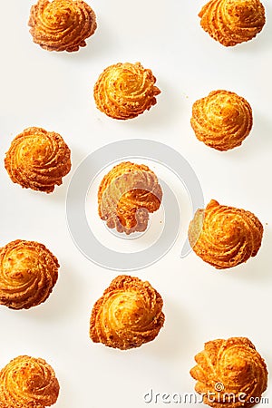 Twirls of crisp fried golden potato on white Stock Photo
