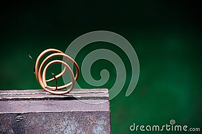 Twisted piece of electrical wire on a metal vise Stock Photo
