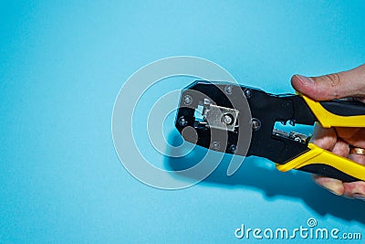 Twisting Cable Tool Twisted Pair Ethernet UTP Cat 5, Crimping RJ45 LAN cable, internet or telephone line cables and crimper,, Stock Photo