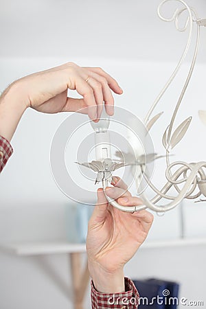 Twisting a light bulb Stock Photo