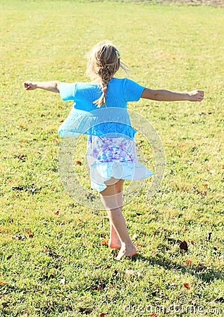 Twisting little girl Stock Photo